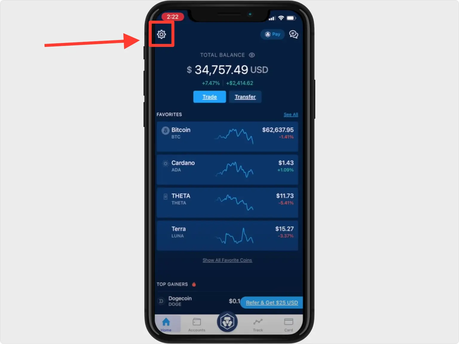 Screenshot from the crypto.com app on an iPhone showing the total balance and a red arrow pointing to the settings gear icon in the top-left corner. This is where users can access security settings to enable 2-Factor Authentication (2FA).